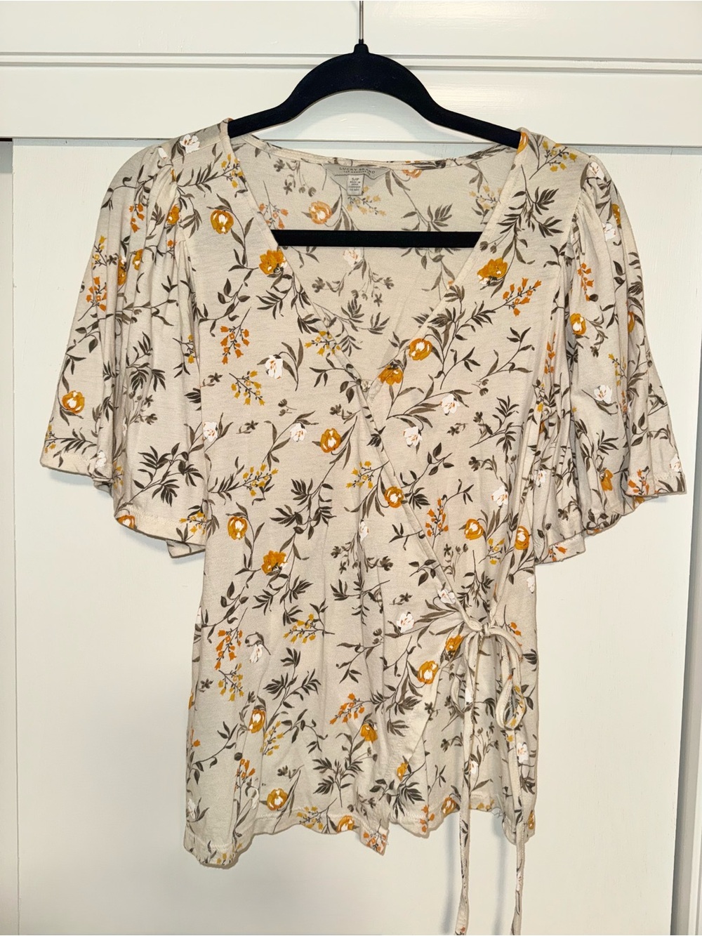Lucky Brand Wrap Top in Cream with Mustard Accents. Small